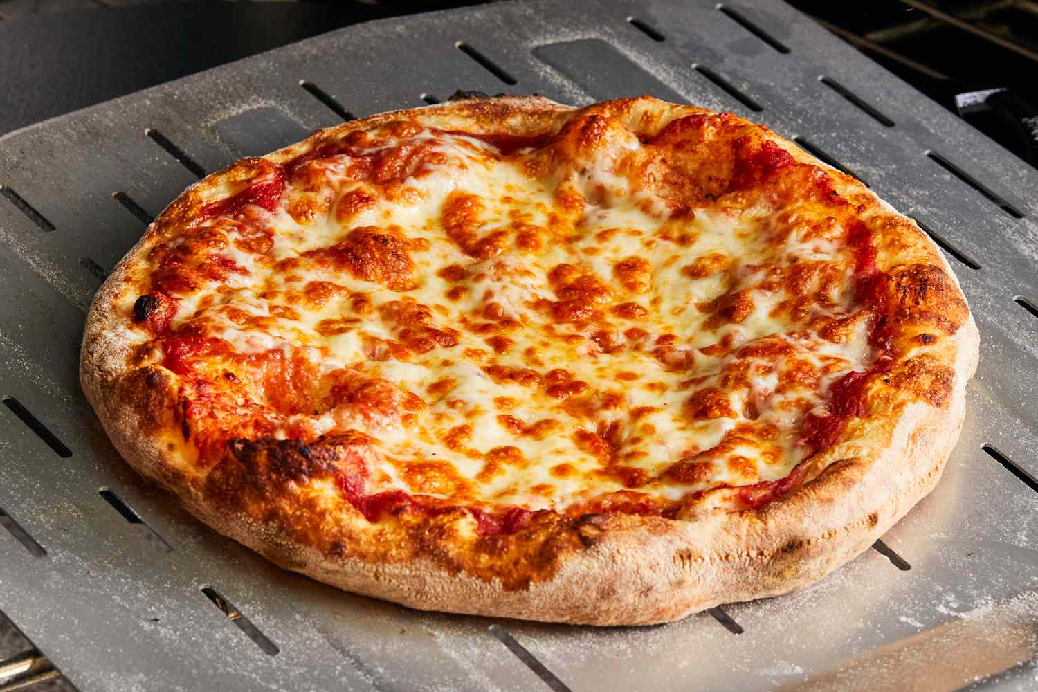 Fresh cheese pizza hot out of the oven at Joe's Pizza